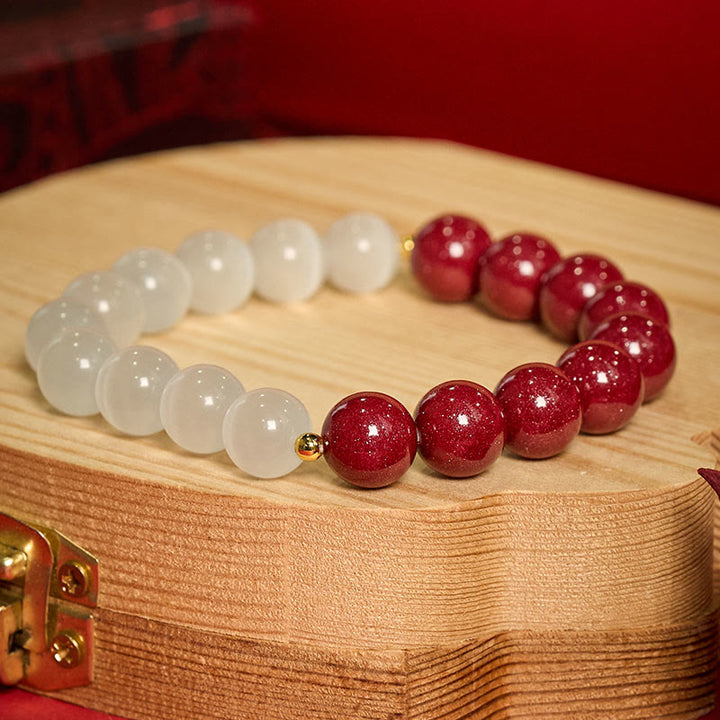 Buddha Stones Cinnabar White Cat's Eye Calm Bracelet - image 1