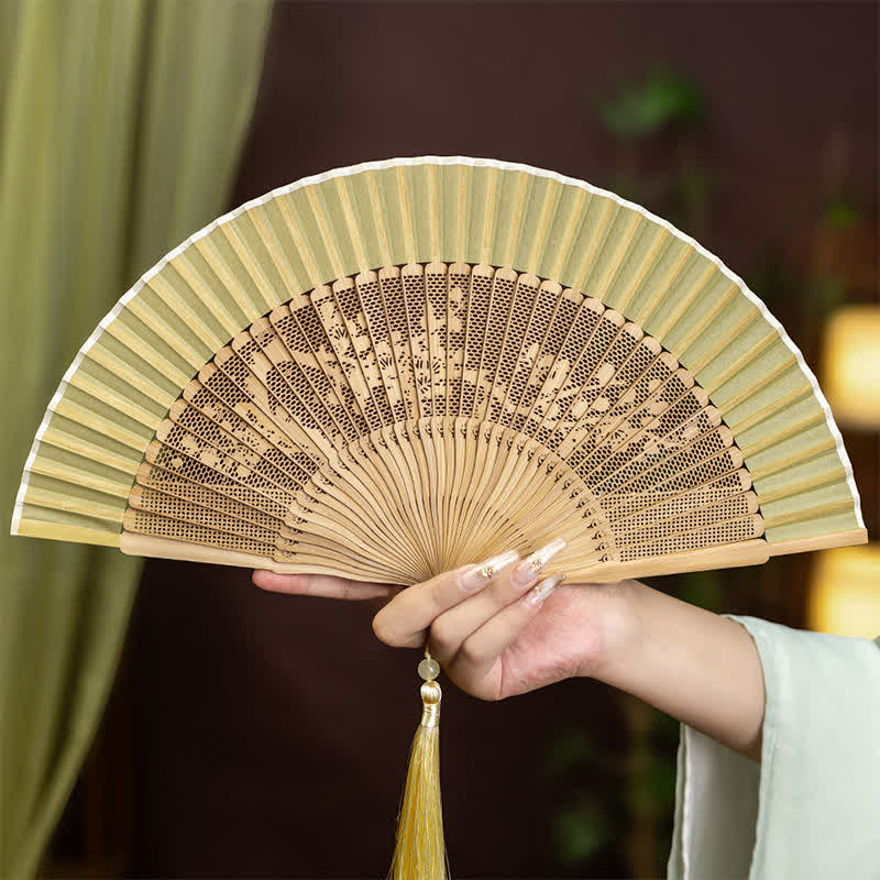 Buddha Stones Bamboo Hollow-Carved Famous Spots Landscapes Animals Tassel Folding Fan - Plum Blossom(Complimentary Tassel) - image 4