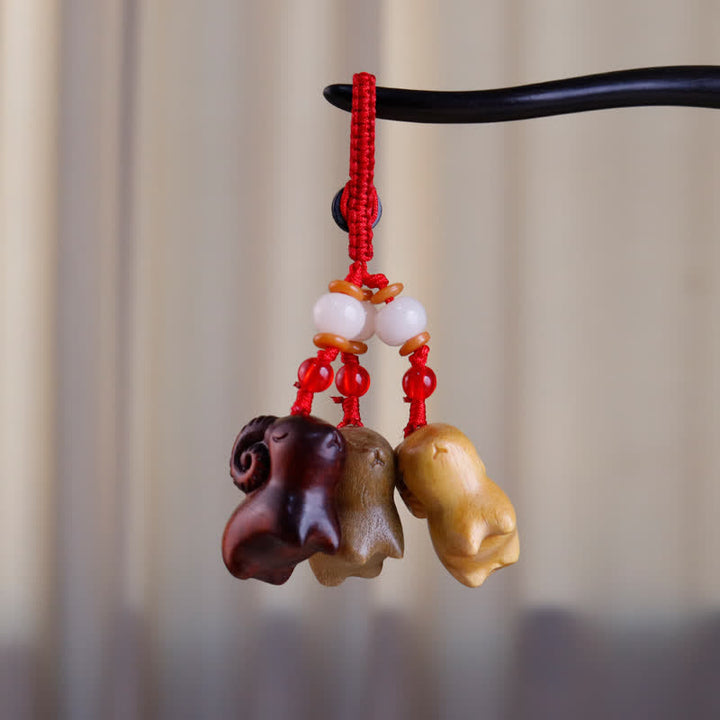 Buddha Stones Hand-Carved Sandalwood Ebony Wood Three Goats Prosperity Keychains - image 3