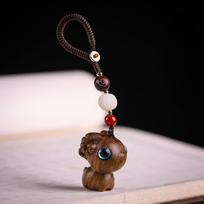 Buddha Stones Year of the Goat Green Sandalwood Red Sandalwood Zodiac Sheep Serenity Hand Carved Braided Keychains - Green Sandalwood Keychain - image 0