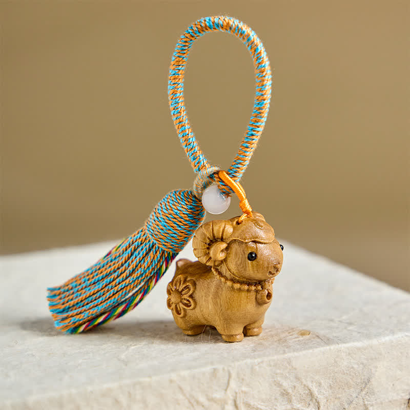 Buddha Stones Year of the Goat Green Sandalwood Sheep Chinese Zodiac Serenity Hand-Carved Tassel Keychains - Green-Sandalwood Flower Sheep - Blue & Orange Tassel - image 0
