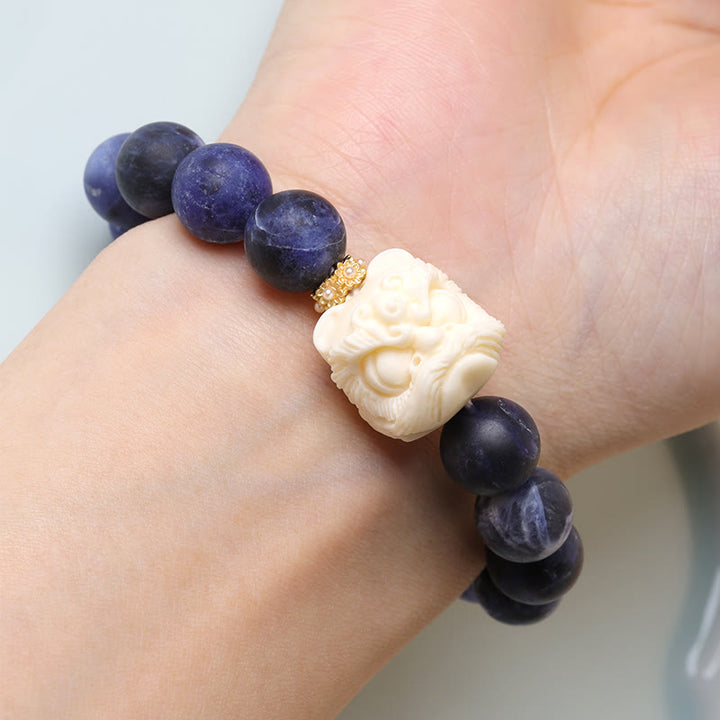 Buddha Stones Sodalite Ivory Fruit Dancing Lion Crescent Moon Harmony Bracelet