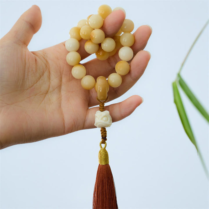 Buddha Stones Natural Bodhi Seed Ivory Fruit Dancing Lion Charm Harmony Tassel Wrist Mala