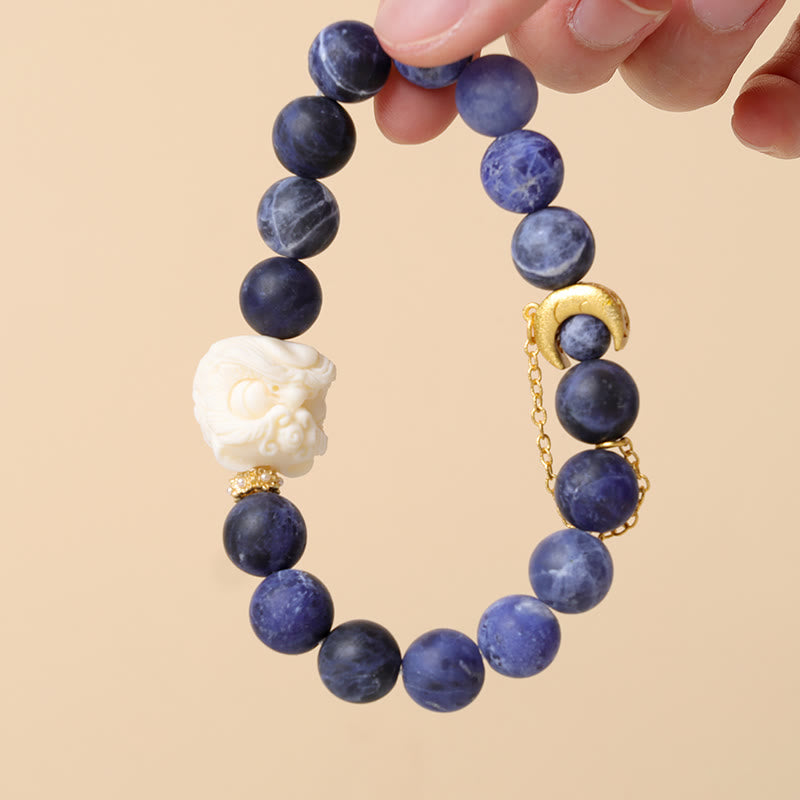 Buddha Stones Sodalite Ivory Fruit Dancing Lion Crescent Moon Harmony Bracelet