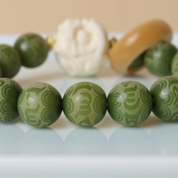 Buddha Stones Green Bodhi Seed Ivory Fruit Dancing Lion Om Mani Padme Hum Engraved Peace Bracelet