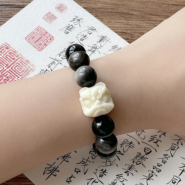 Buddha Stones Silver Sheen Obsidian Bodhi Seed Ivory Fruit Dancing Lion Protection Bracelet